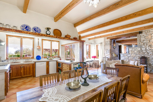 Large dinner table in front of the kitchen