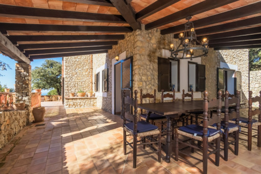 Large dinner table under the covered terrace