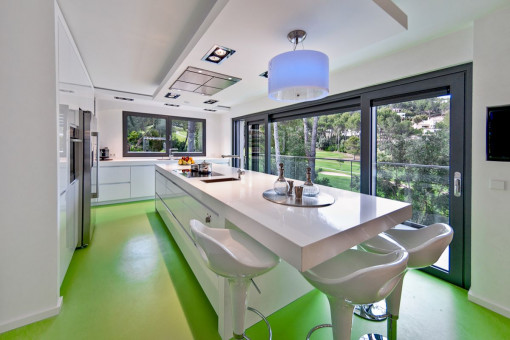 Fully equipped kitchen with long dinner table