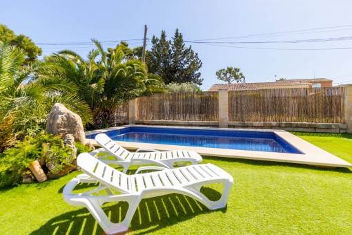 Well-kept lawns surrounding the swimming pool