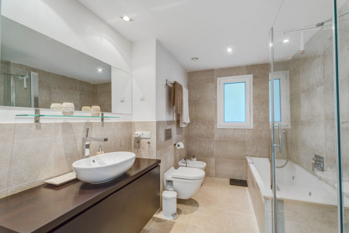 Modern bathroom with bathtub and shower