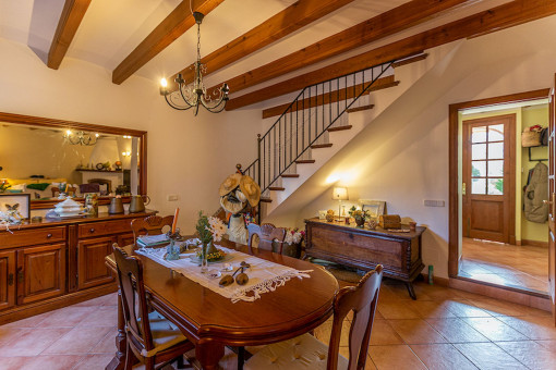 Dining area with wooden ceiling beams