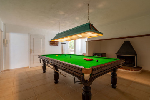 Billiards table is located in the beasement