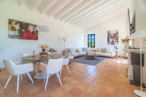 Open living and dining area with fireplace