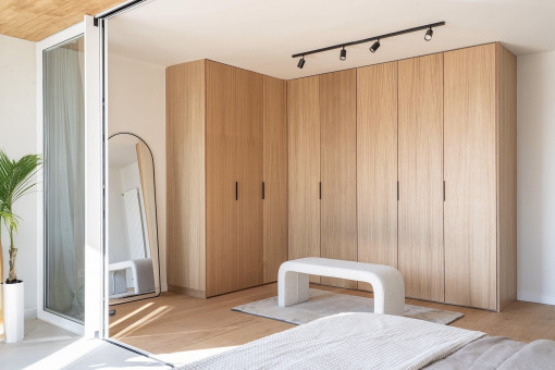 Open walk-in closet in master bedroom