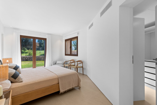 One of the 4 bedrooms with en suite bathroom and walk-in wardrobe