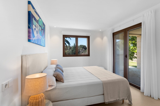 One of the 4 bedrooms with en suite bathroom and direct garden access