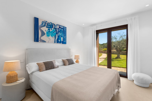 One of the 4 bedrooms with en suite bathroom and direct garden access