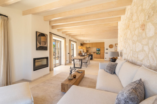 Living and dining area with wooden beam ceilings