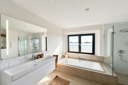 Bathroom with bathtub and shower