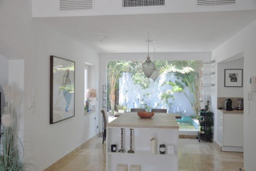 Open plan kitchen and dining area with plenty of natural light