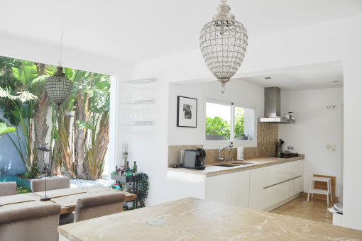 Open plan kitchen and dining area with plenty of natural light