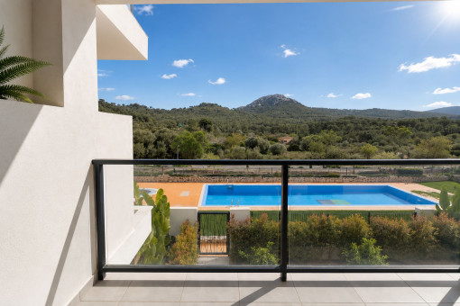 Balcony with views of the pool and Mallorcan landscape