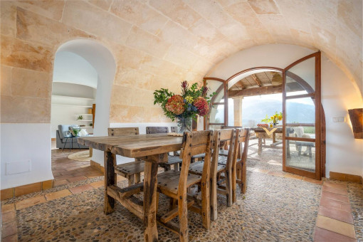 Elegant dining room with vaulted ceiling and mountain view