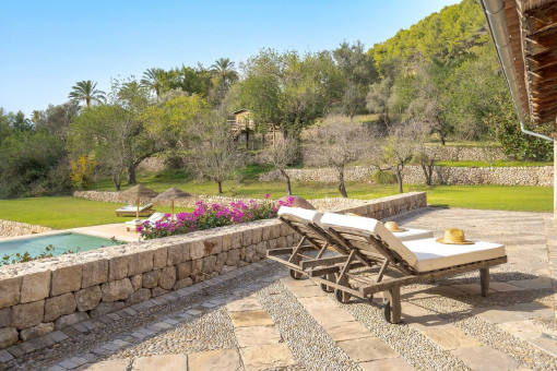 Sun terrace with saltwater pool and comfortable loungers in a Mediterranean setting