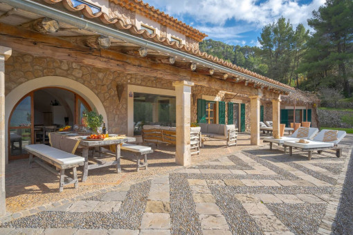 Covered terrace with dining table and Mediterranean atmosphere