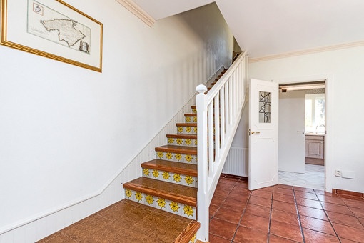 Staircase leads to the upper floor