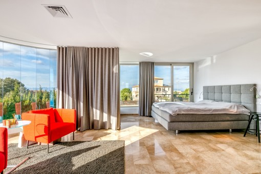 Capacious master bedroom with fantastic glass façade