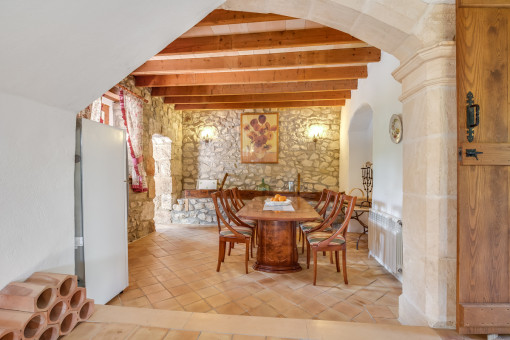 Authentic dining area with natural stone wall