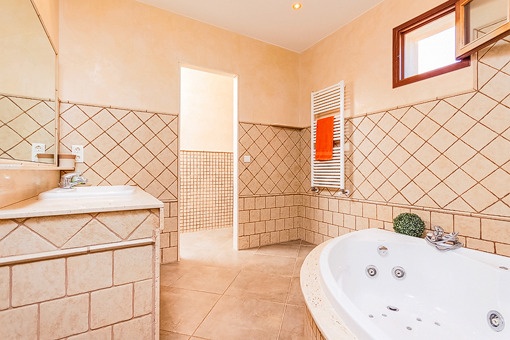 Master bathroom with bath tub