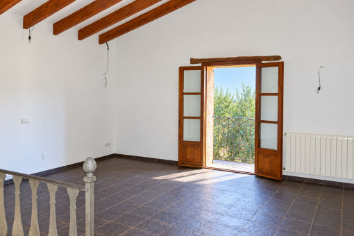 Large room with wooden ceiling beams