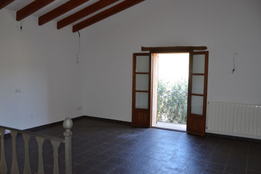 Large room with wooden ceiling beams