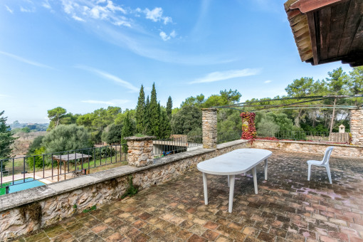 Spacious terrace with pool views