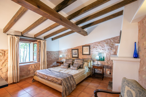 Authentic bedroom with sandstone wall