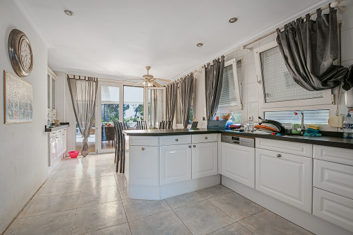 Kitchen with further dining area