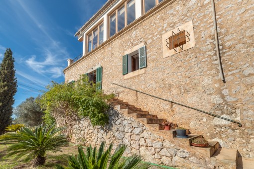 Outside stone stairs lead to the garden