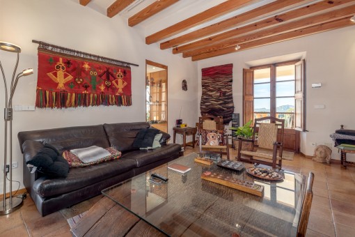 Living area with wooden ceiling beams