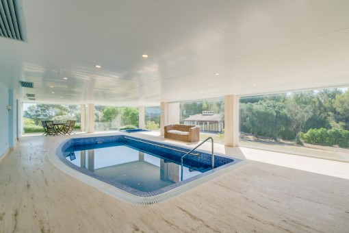 Indoor pool with garden views