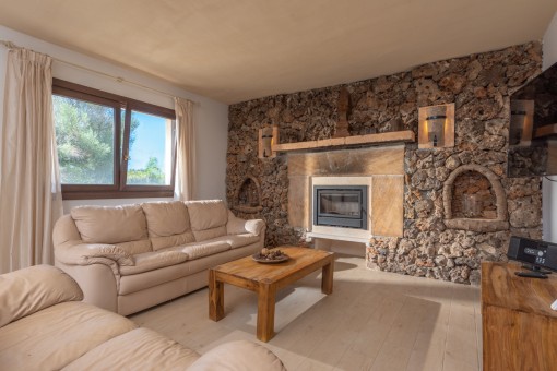 Living area with rustic stone wall