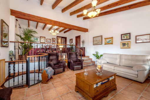 Comfortable living area with wooden ceiling beams