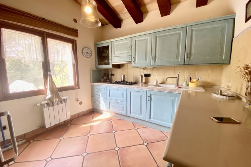 Kitchen with wooden ceiling beams