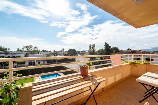 Covered balcony with pool views
