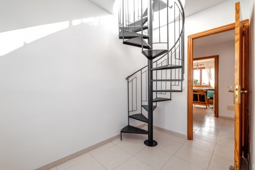 Stairs lead to the  roof terrace