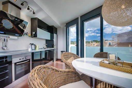 Kitchen and dining area with terrace access
