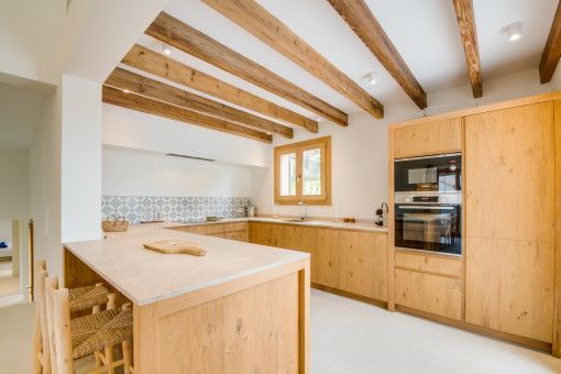 New kitchen with wooden ceiling beams 