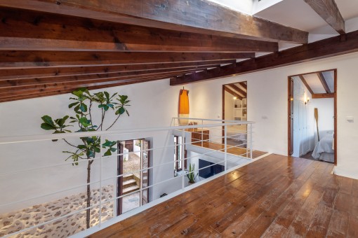 Open gallery with wooden ceiling beams
