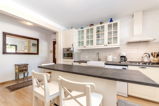 Kitchen and dining area in white