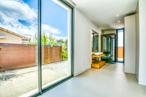 Bedroom with open bathroom