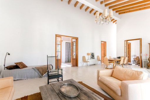 Spacious living area with beautiful wooden ceiling beams