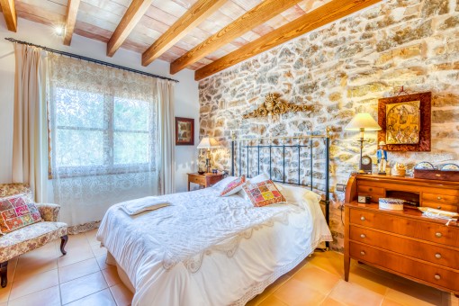 Bedroom with natural stone wall