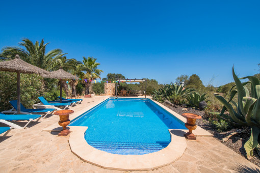 Splendid pool with sun loungers