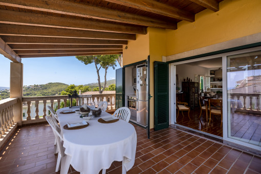 Terrace with dining area and exterior kitchen