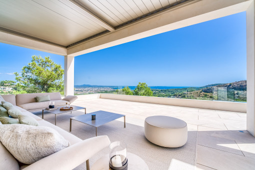 Large covered terrace with seating area