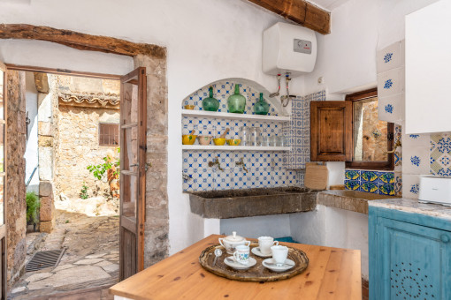 Rustic mallorquin kitchen with patio access