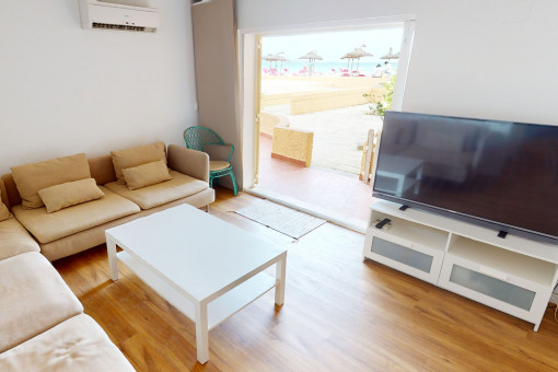 Light flooded living area with terrace access
