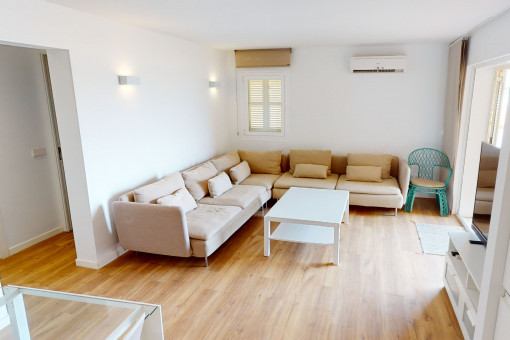 Light flooded living area with terrace access